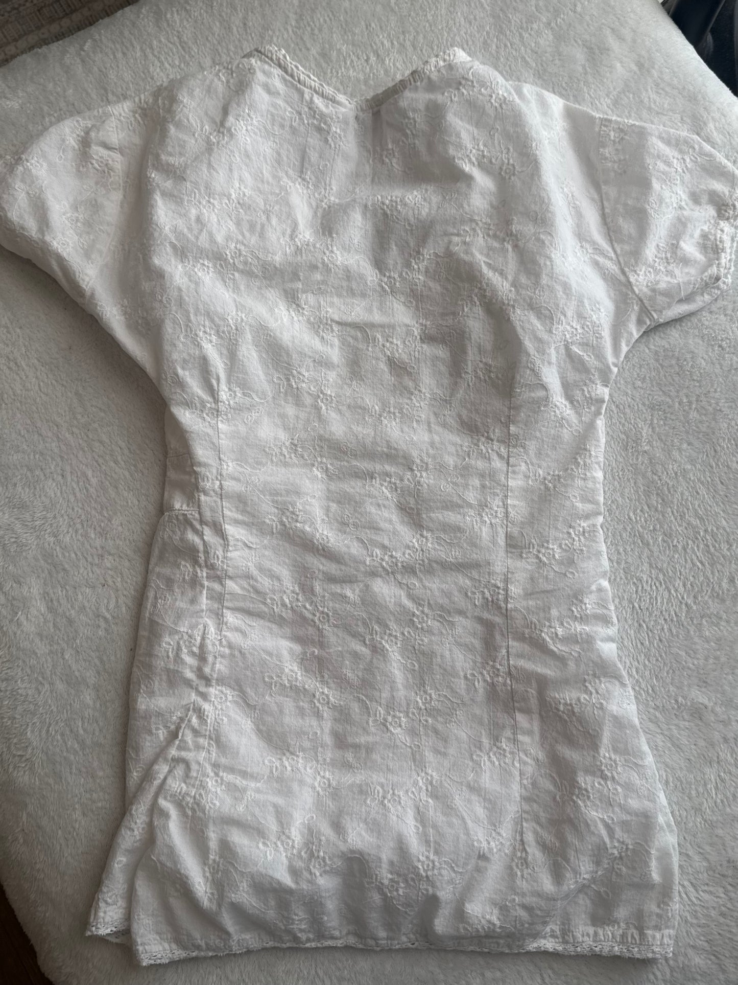White Top with Embroidered Design