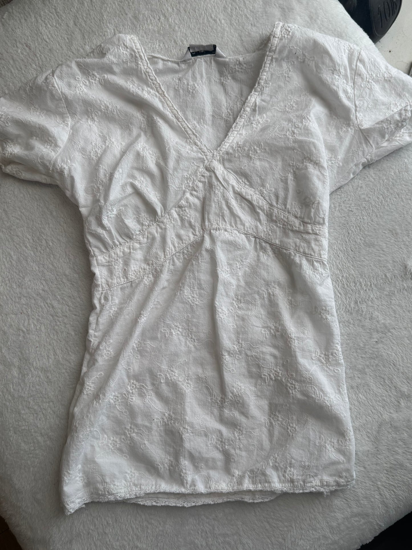 White Top with Embroidered Design