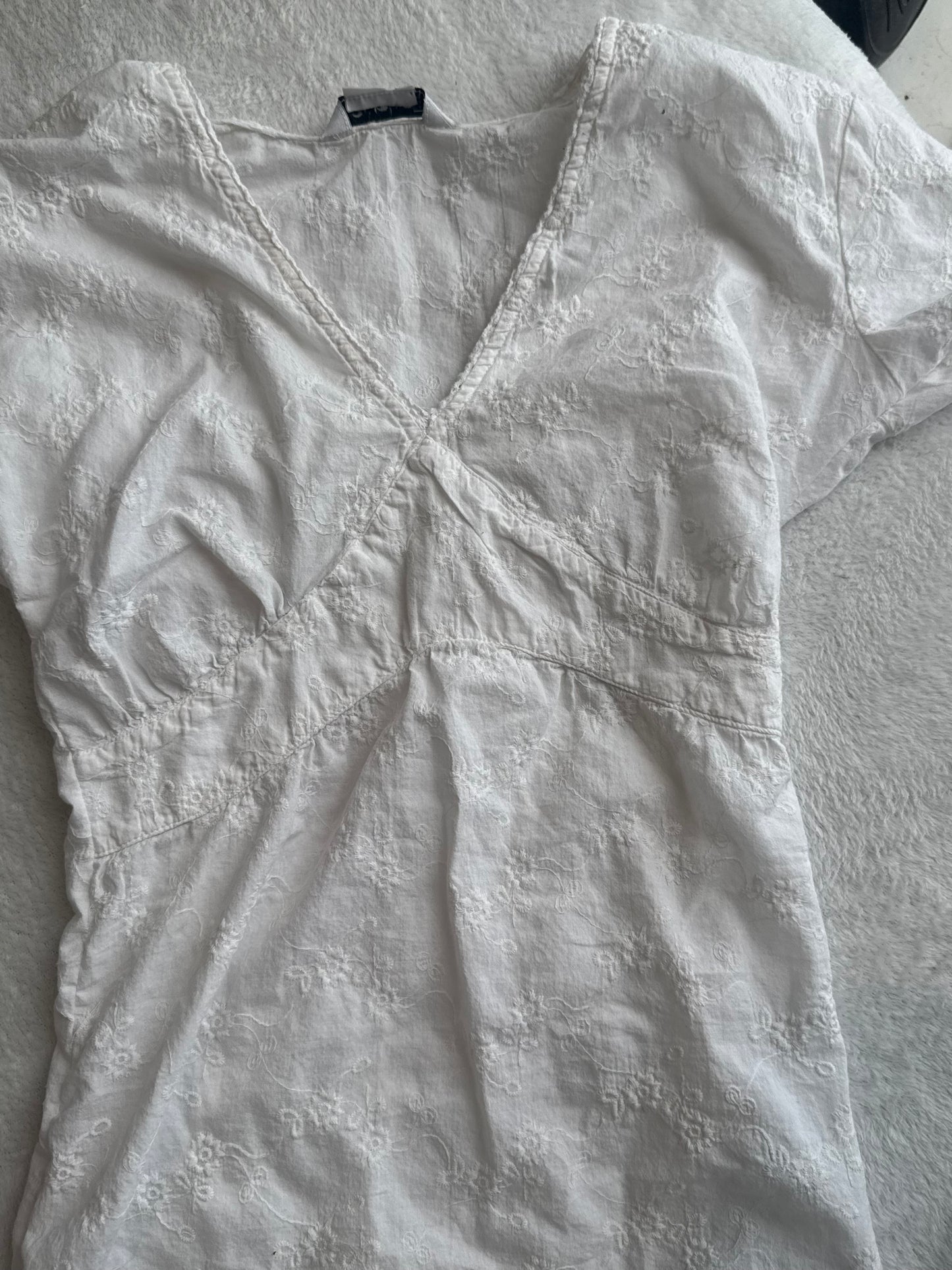 White Top with Embroidered Design