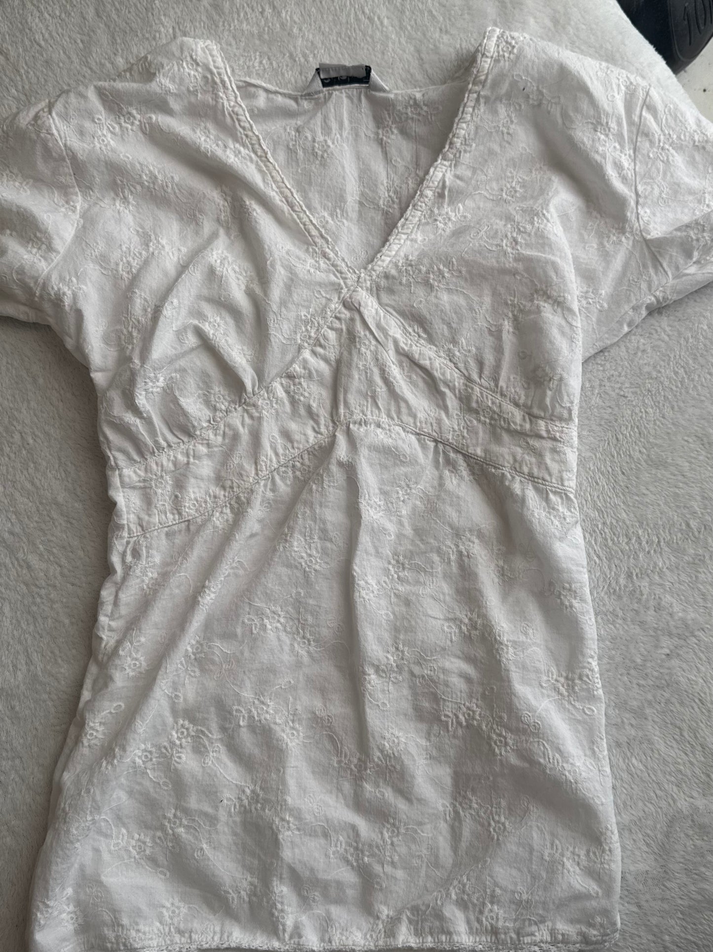 White Top with Embroidered Design